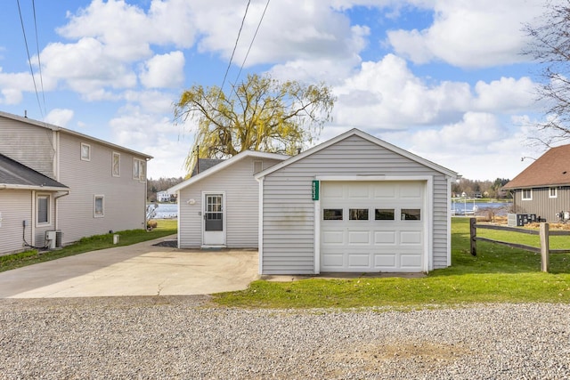 8033 S Portage Rd, Jackson, MI 49201 - detached garage with driveway, central AC, and fence