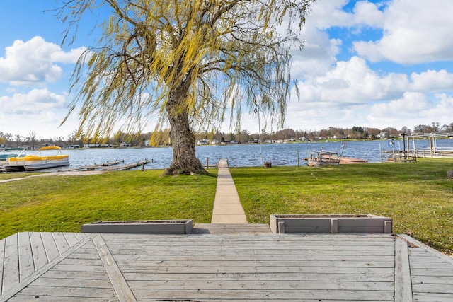 8033 S Portage Rd, Jackson, MI 49201 - view of dock with a lawn and a water view