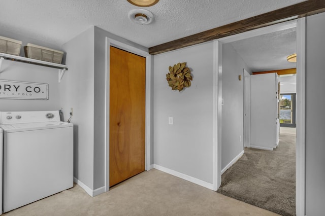 8033 S Portage Rd, Jackson, MI 49201 - laundry room featuring carpet flooring, a textured ceiling, baseboards, laundry area, and washer / dryer