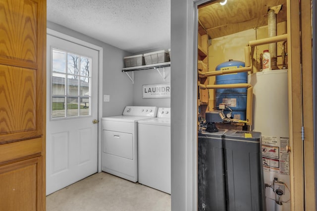 8033 S Portage Rd, Jackson, MI 49201 - washroom featuring independent washer and dryer, gas water heater, a textured ceiling, and laundry area