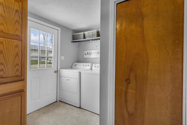8033 S Portage Rd, Jackson, MI 49201 - laundry room with a textured ceiling, washer and dryer, and laundry area