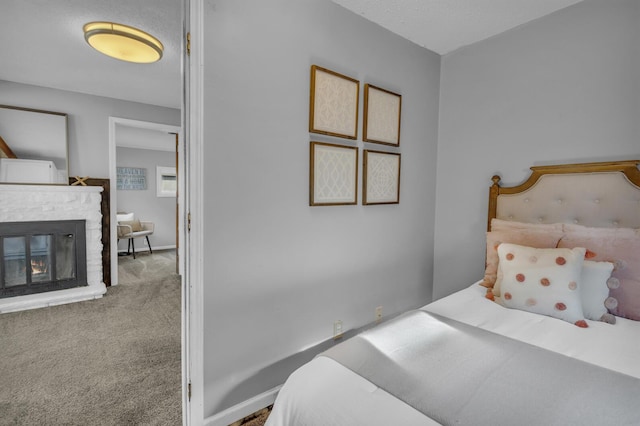 8033 S Portage Rd, Jackson, MI 49201 - carpeted bedroom with a glass covered fireplace