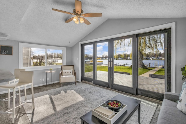 8033 S Portage Rd, Jackson, MI 49201 - living area featuring vaulted ceiling, a textured ceiling, and a ceiling fan