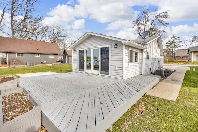 8033 S Portage Rd, Jackson, MI 49201 - wooden terrace featuring cooling unit and a lawn
