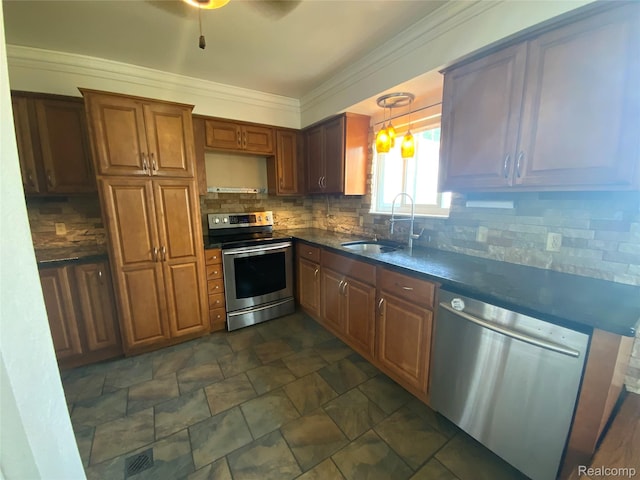 135 Gerald Ave, Clawson, MI 48017 - kitchen with appliances with stainless steel finishes, a sink, dark countertops, tasteful backsplash, and stone finish floors