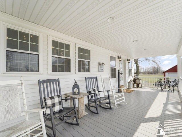 wooden deck featuring a porch