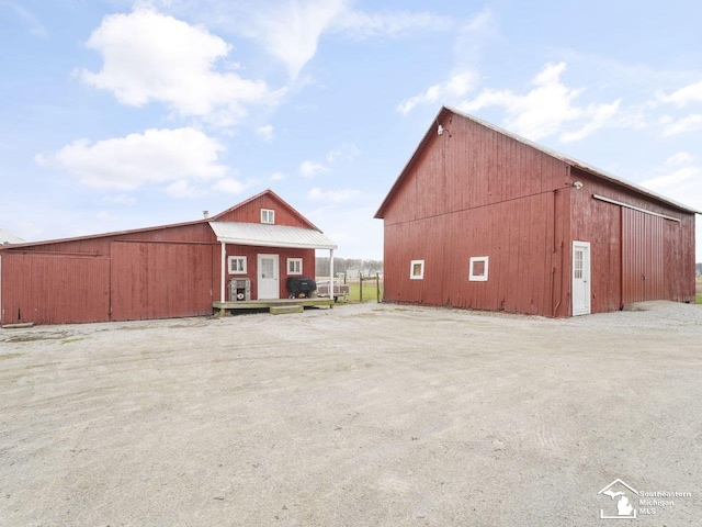 view of property featuring an outbuilding and a garage