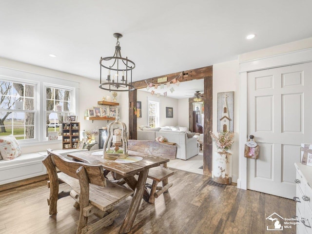 dining room featuring wood finished floors, recessed lighting, and ceiling fan with notable chandelier