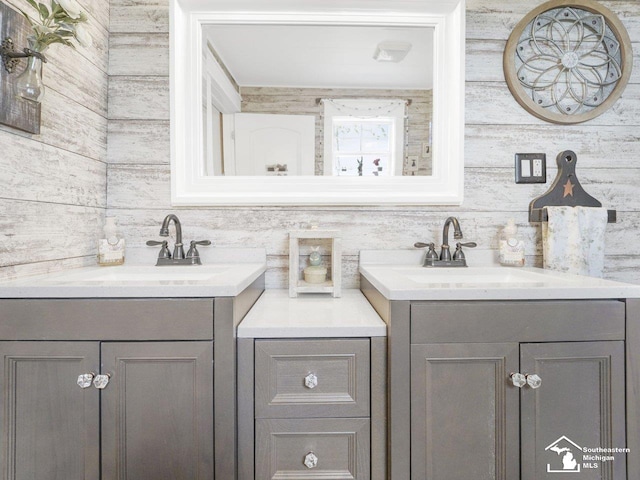 bathroom featuring two vanities and a sink