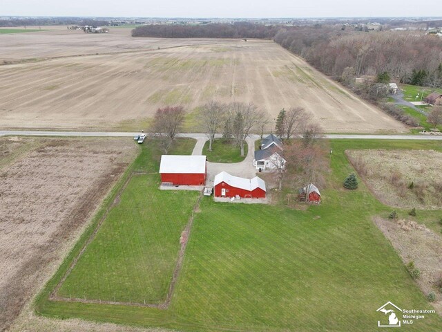 birds eye view of property with a rural view