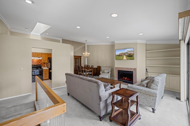 living room with recessed lighting, ornamental molding, and light colored carpet
