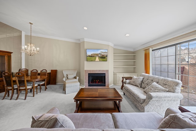 carpeted living area featuring recessed lighting, a fireplace, built in shelves, a notable chandelier, and crown molding
