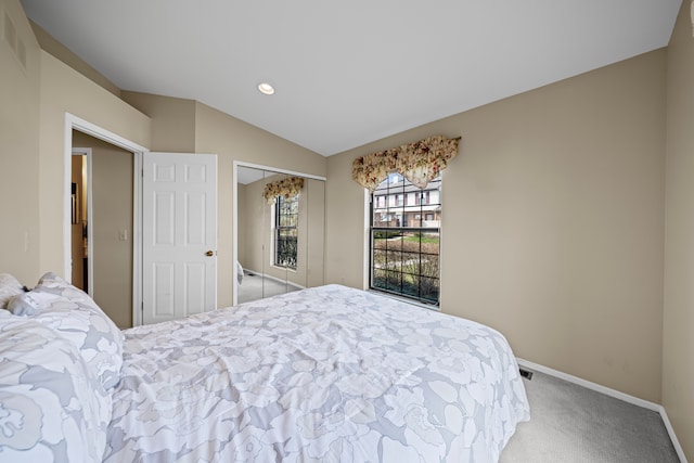 carpeted bedroom featuring recessed lighting, a closet, baseboards, visible vents, and lofted ceiling