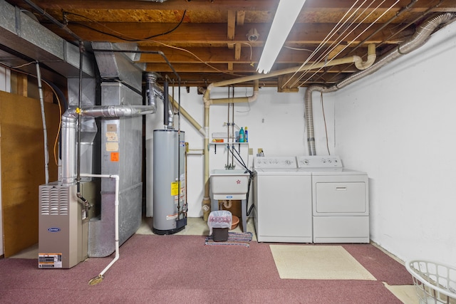 unfinished below grade area with water heater, washing machine and clothes dryer, a sink, and carpet floors