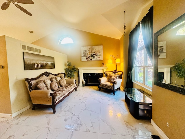 living area with visible vents, a ceiling fan, a high end fireplace, and marble finish floor