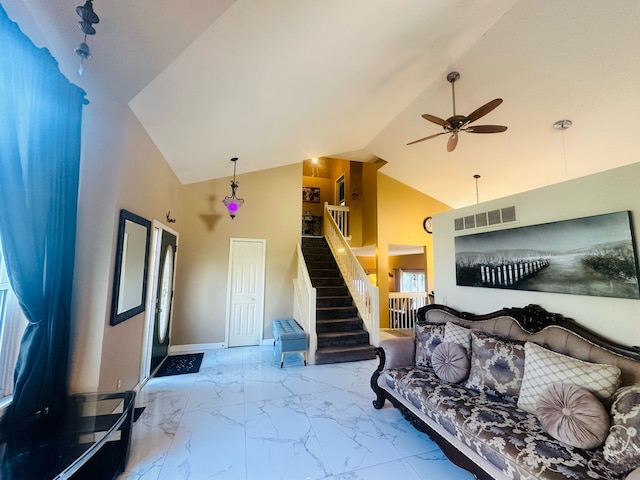 living room with stairway, visible vents, a ceiling fan, high vaulted ceiling, and marble finish floor