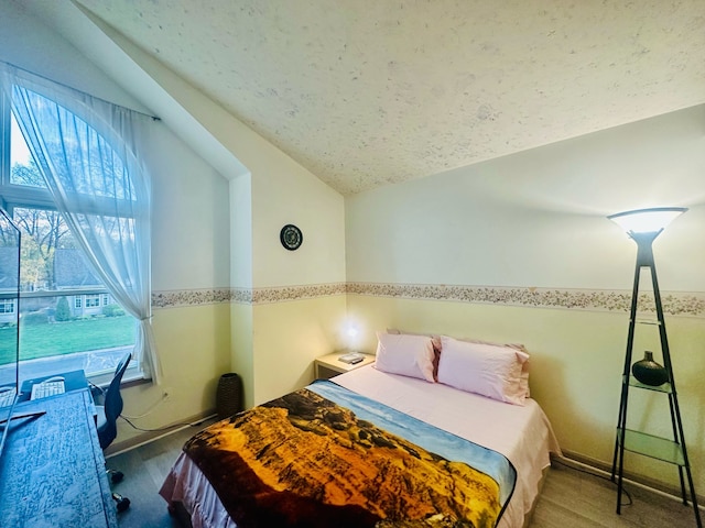 bedroom featuring vaulted ceiling