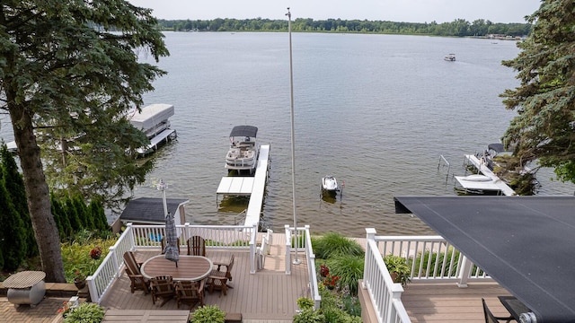 view of dock with a deck with water view