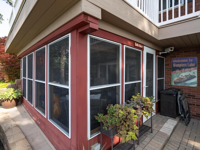 view of side of property featuring a balcony
