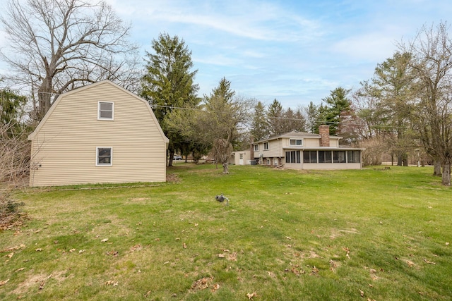 view of yard featuring a sunroom
