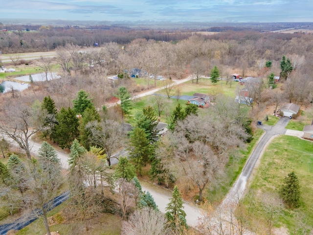 drone / aerial view featuring a forest view