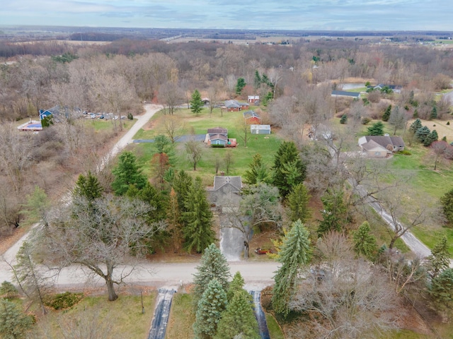 drone / aerial view featuring a view of trees