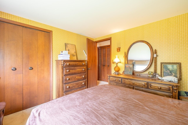 bedroom with wallpapered walls