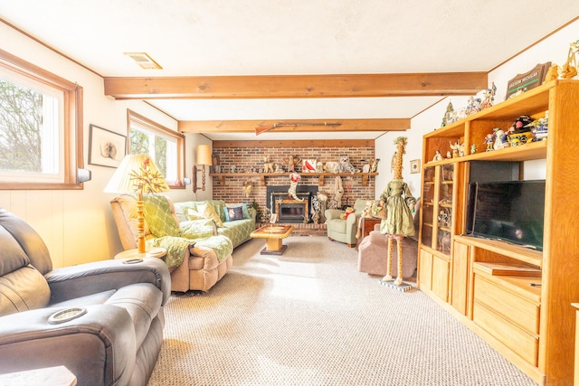 carpeted living area featuring beamed ceiling and visible vents