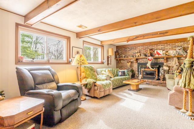 interior space featuring beamed ceiling, carpet, a fireplace, and visible vents