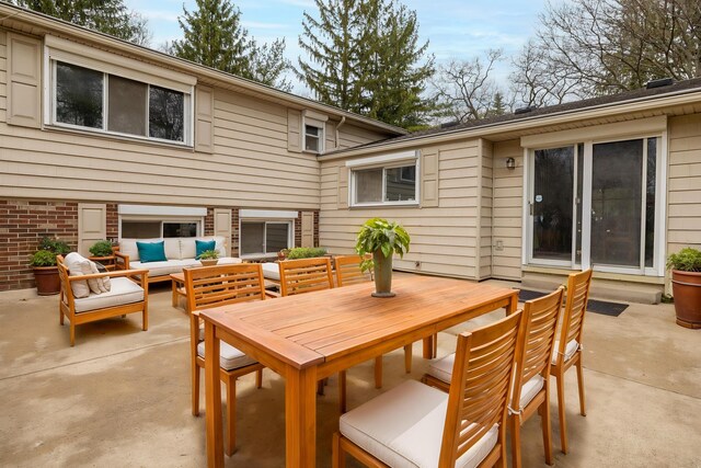 view of patio with outdoor lounge area and outdoor dining area