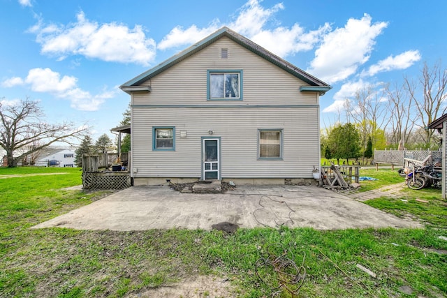 8825 Mills Rd, Manitou Beach, MI 49253 - back of property featuring a patio area, a lawn, and a deck