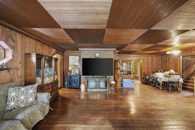 8825 Mills Rd, Manitou Beach, MI 49253 - living area featuring wood walls, wood ceiling, hardwood / wood-style floors, and stairway