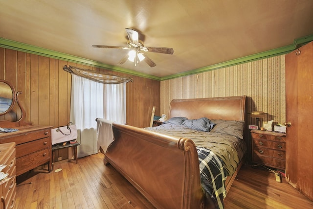 8825 Mills Rd, Manitou Beach, MI 49253 - bedroom with hardwood / wood-style flooring and a ceiling fan