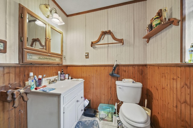 8825 Mills Rd, Manitou Beach, MI 49253 - bathroom with toilet, wooden walls, wainscoting, vanity, and ornamental molding