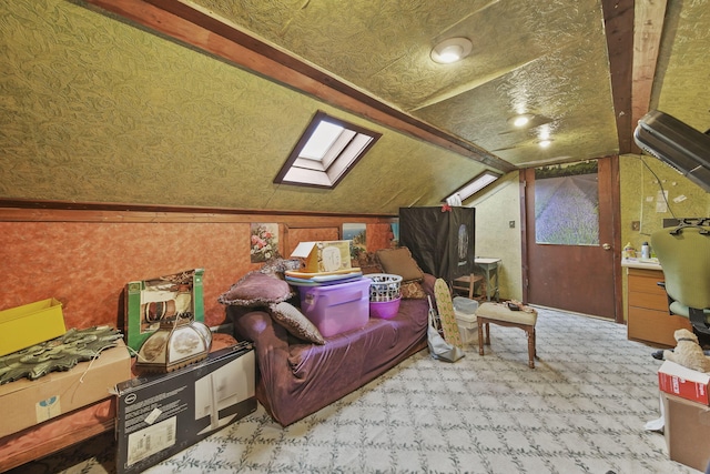 8825 Mills Rd, Manitou Beach, MI 49253 - bonus room featuring a skylight, vaulted ceiling, and carpet flooring