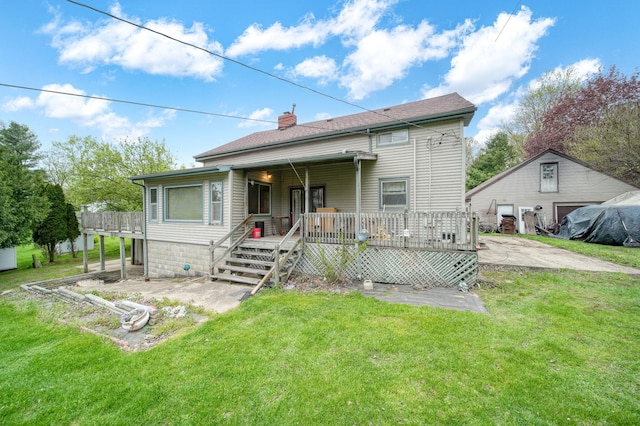 8825 Mills Rd, Manitou Beach, MI 49253 - back of house with a yard, a porch, and a chimney