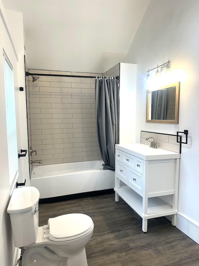 full bathroom with shower / bath combination with curtain, toilet, vanity, and wood finished floors