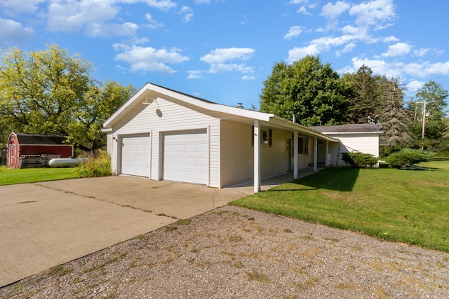 4345 W Mcnally Rd, Coleman, MI 48618 - exterior space with a lawn, a storage shed, and a garage