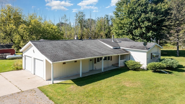 4345 W Mcnally Rd, Coleman, MI 48618 - view of front facade with a front lawn, a porch, a shingled roof, and a garage