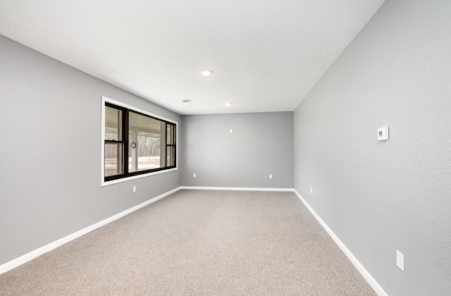 4345 W Mcnally Rd, Coleman, MI 48618 - carpeted empty room featuring baseboards and recessed lighting