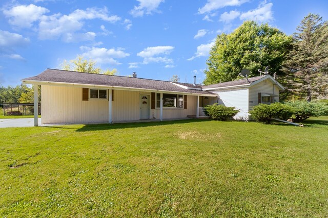 4345 W Mcnally Rd, Coleman, MI 48618 - ranch-style home with a front yard and an attached carport