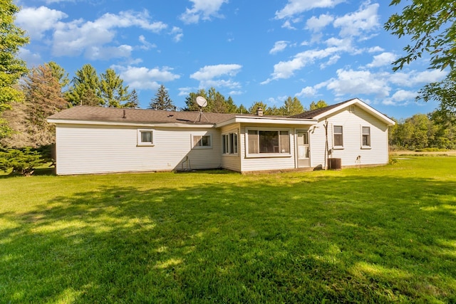 4345 W Mcnally Rd, Coleman, MI 48618 - back of house with a yard