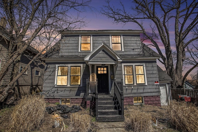 view of front of home featuring fence