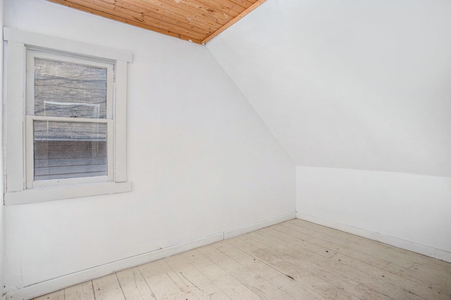 bonus room with hardwood / wood-style flooring, lofted ceiling, wood ceiling, and baseboards