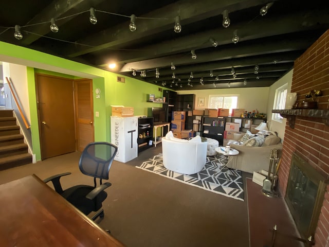 living area featuring a fireplace and stairway