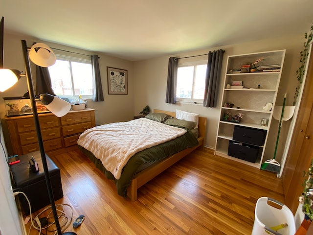 bedroom with wood finished floors