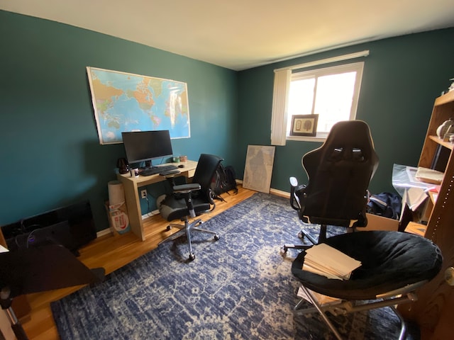 office with baseboards and wood finished floors
