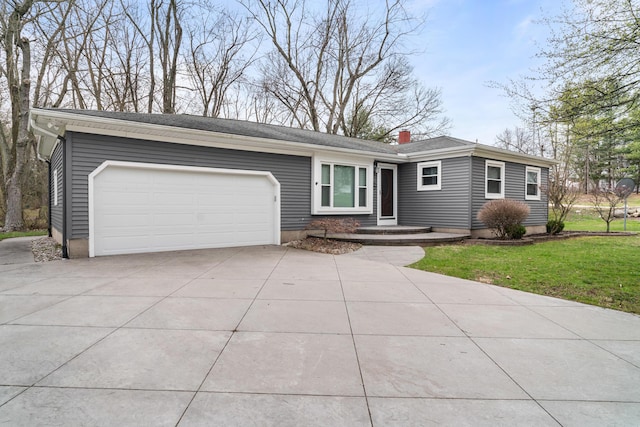single story home featuring driveway, a front yard, and a garage