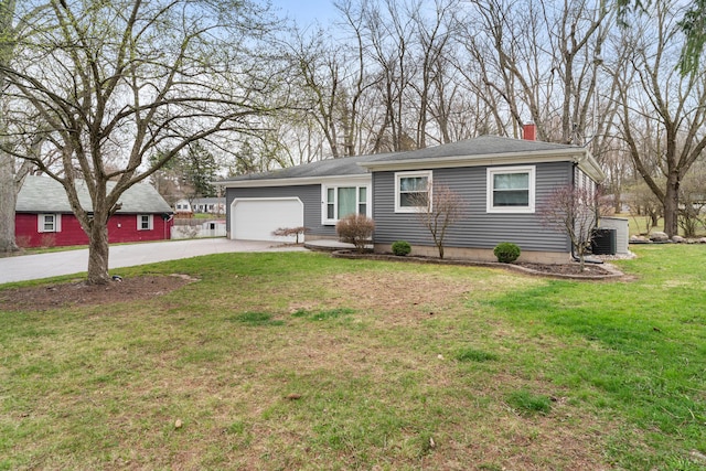 single story home featuring a chimney, a front lawn, central air condition unit, concrete driveway, and an attached garage