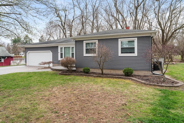single story home with a chimney, an attached garage, driveway, and a front lawn